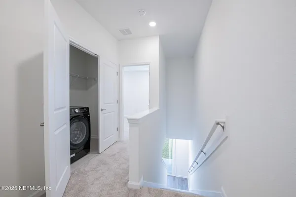 a view of hallway with stairs