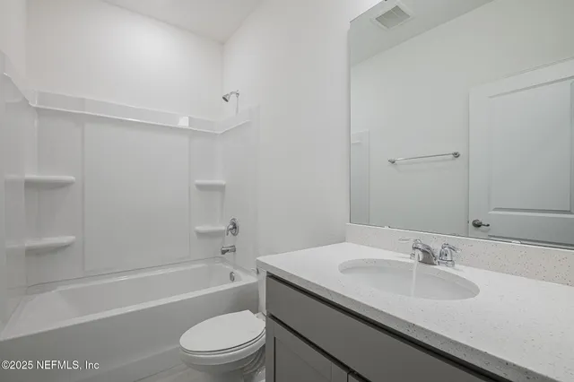 a bathroom with a sink a toilet and a bathtub