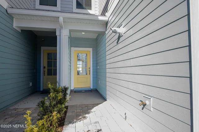 a view of house with backyard