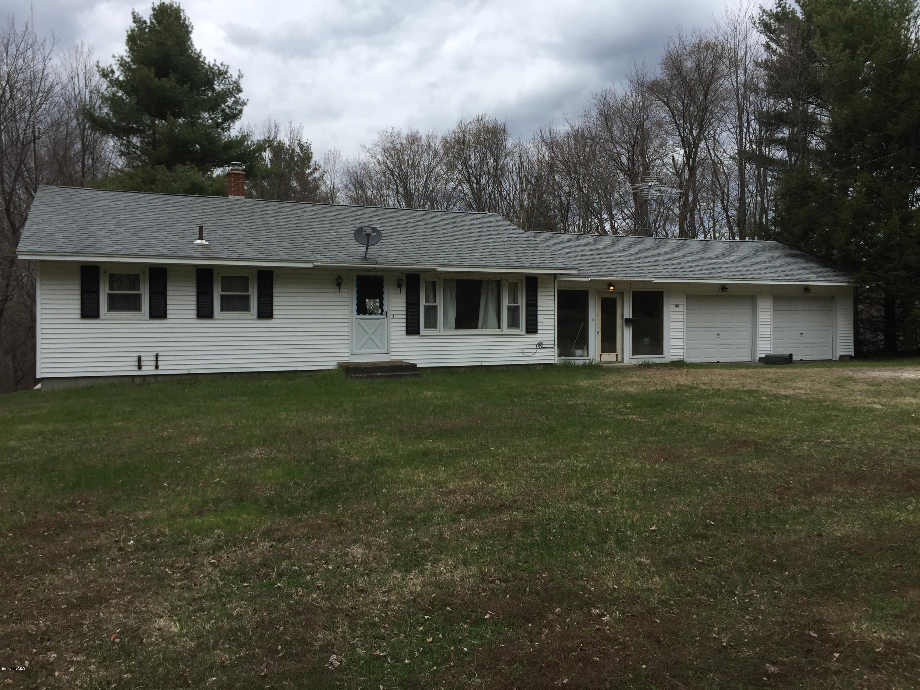 85 Summit Hill Road Washington, MA 01223 - Photo 1 of 2 a front view of a house with a garden