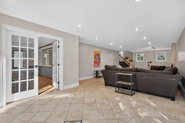 a living room with furniture and windows