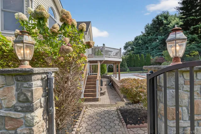 a view of a house with brick walls and a potted plant