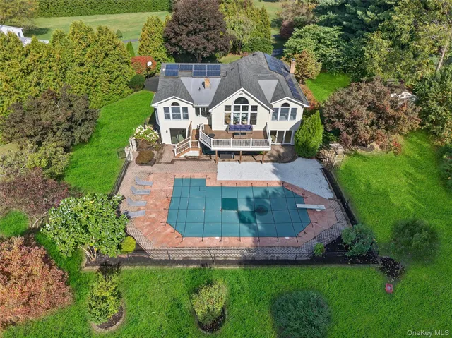 an aerial view of a house with a garden