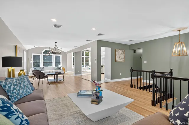 a living room with furniture and a table