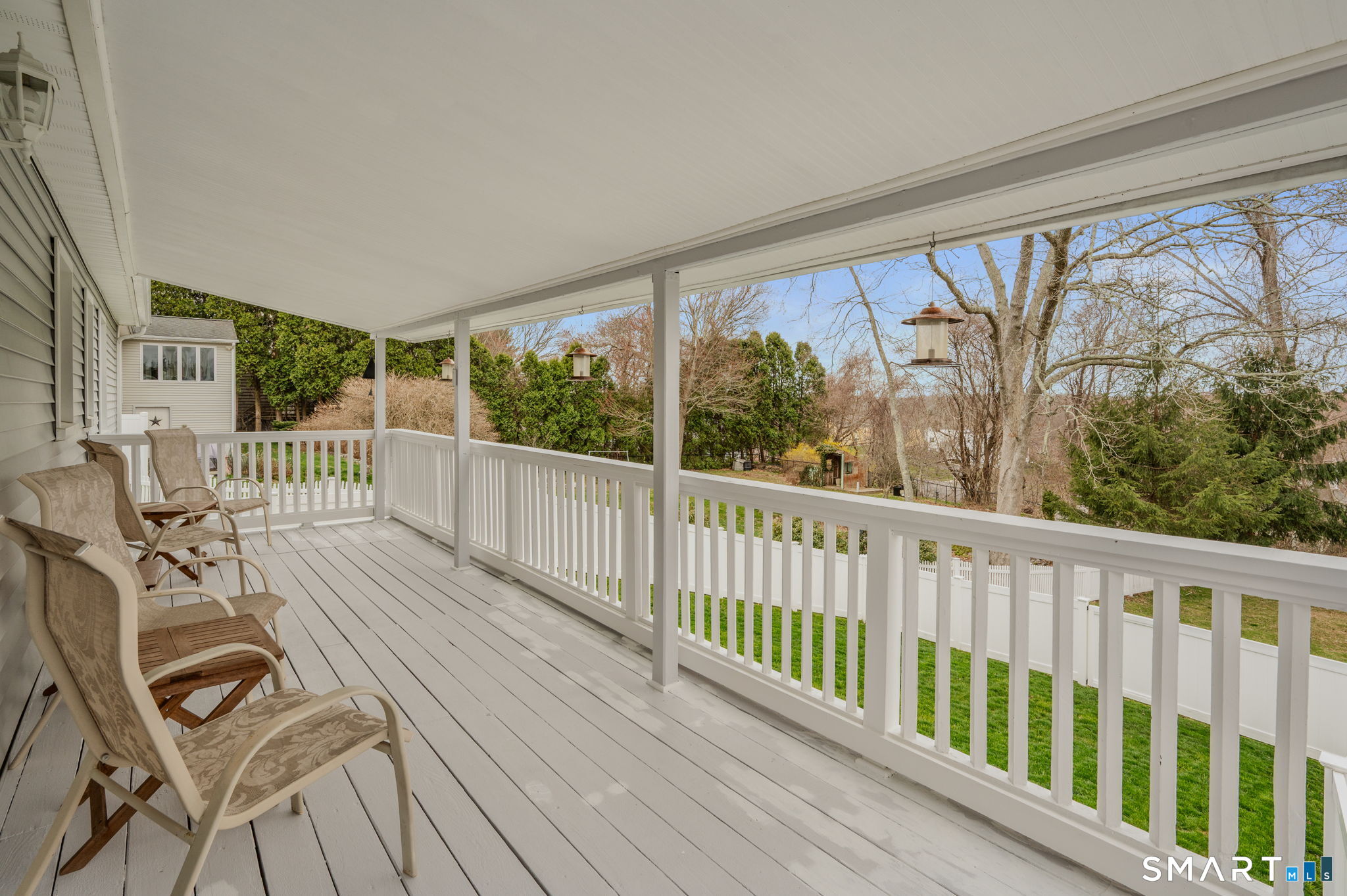 541 Groton Long Point Road Groton, CT 06340 - Photo 8 of 21 Long back deck overlooking the grounds.