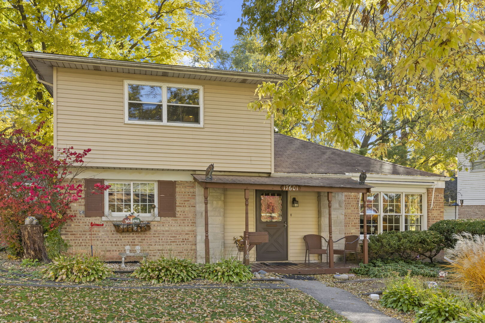 a front view of a house with garden