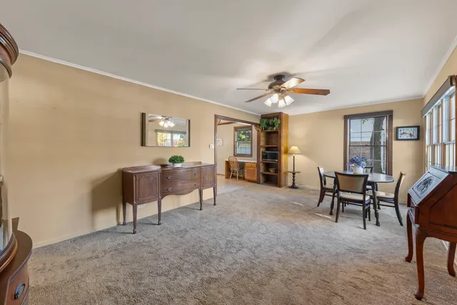 a view of a livingroom with furniture and a window