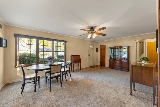 a view of a livingroom with furniture and a window