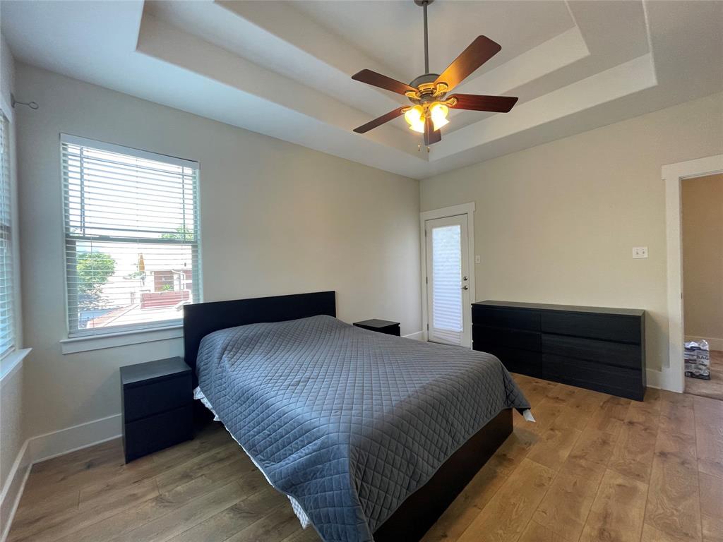 1007 Taulbee Lane, Unit B Austin, TX 78757 - Photo 16 of 36 Bedroom featuring light wood finished floors and a ceiling fan