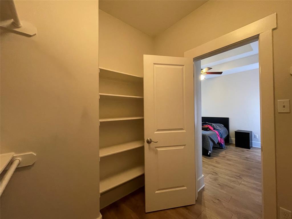 1007 Taulbee Lane, Unit B Austin, TX 78757 - Photo 21 of 36 Walk in closet featuring dark wood finished floors and ceiling fan