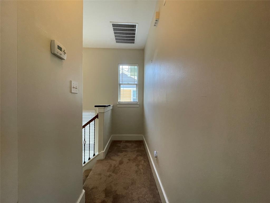 1007 Taulbee Lane, Unit B Austin, TX 78757 - Photo 26 of 36 Corridor featuring carpet and baseboards