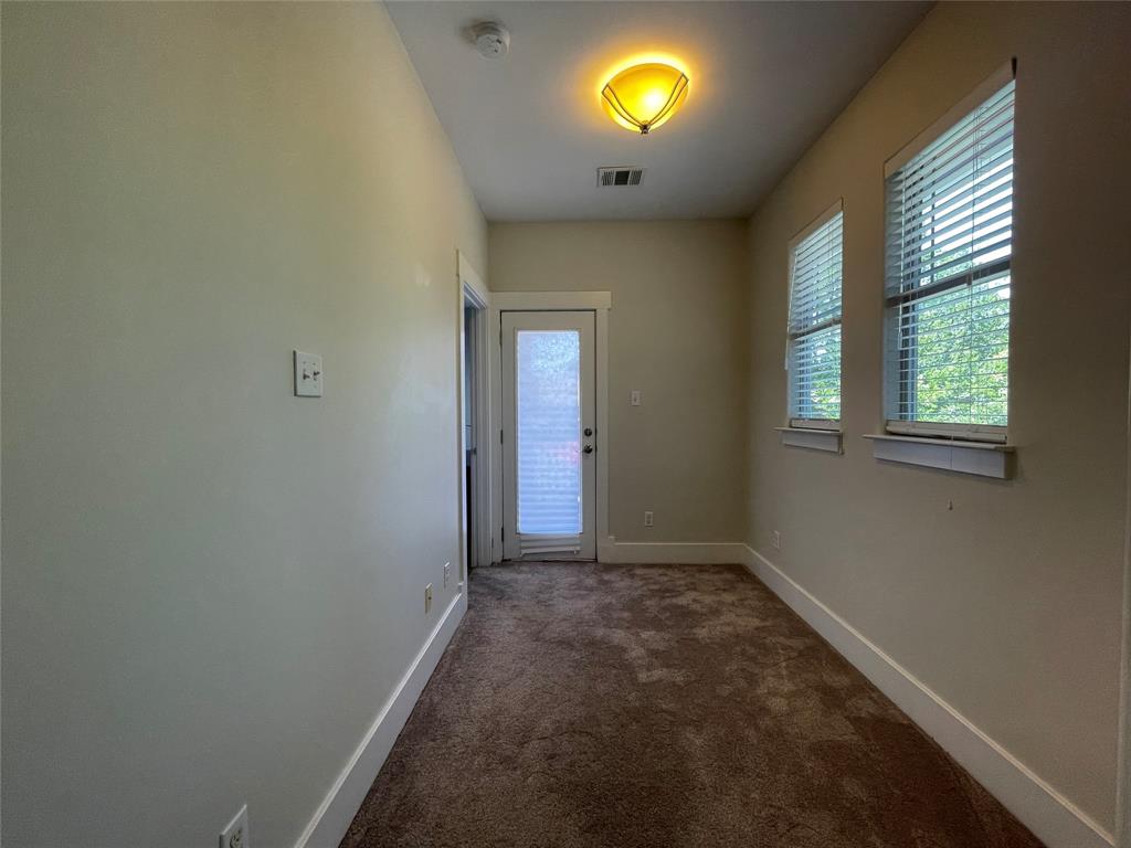 1007 Taulbee Lane, Unit B Austin, TX 78757 - Photo 27 of 36 Entryway featuring carpet floors and baseboards