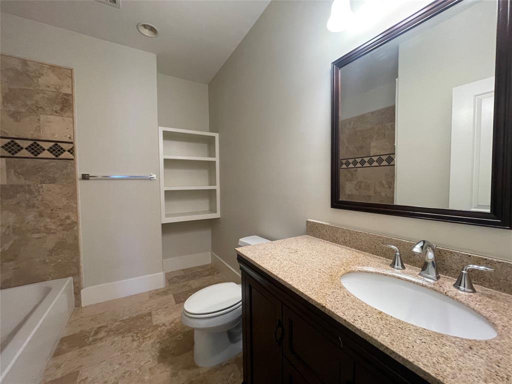 1007 Taulbee Lane, Unit B Austin, TX 78757 - Photo 29 of 36 Full bath featuring toilet and vanity