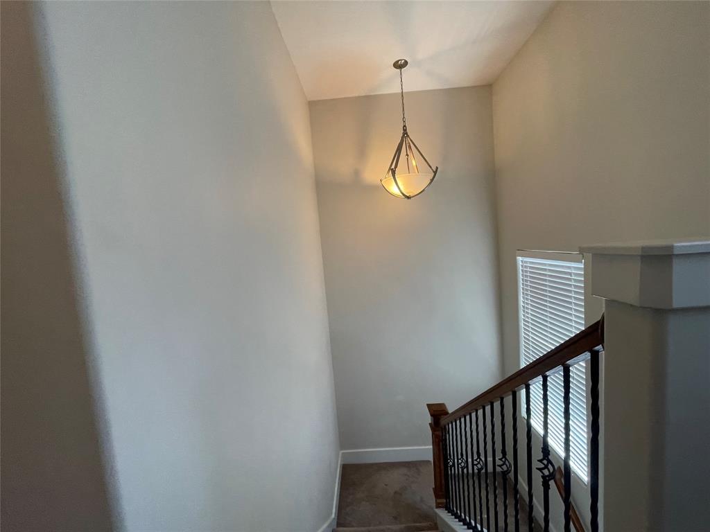 1007 Taulbee Lane, Unit B Austin, TX 78757 - Photo 31 of 36 Stairway with baseboards