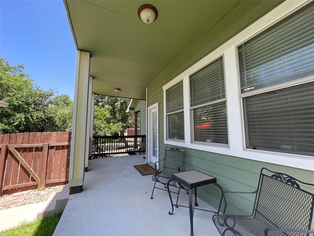 1007 Taulbee Lane, Unit B Austin, TX 78757 - Photo 34 of 36 View of patio / terrace with a gate