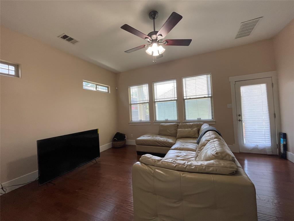 1007 Taulbee Lane, Unit B Austin, TX 78757 - Photo 6 of 36 Living room with a ceiling fan, dark wood-type flooring, and healthy amount of natural light