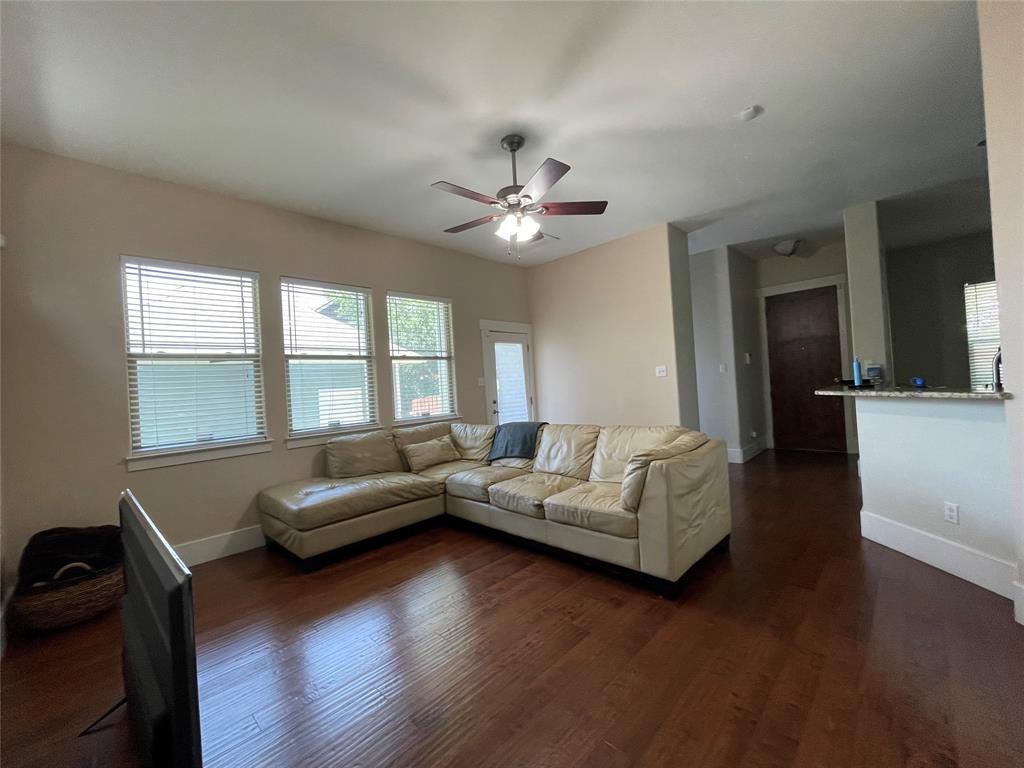 1007 Taulbee Lane, Unit B Austin, TX 78757 - Photo 7 of 36 Living area featuring dark wood finished floors and a ceiling fan