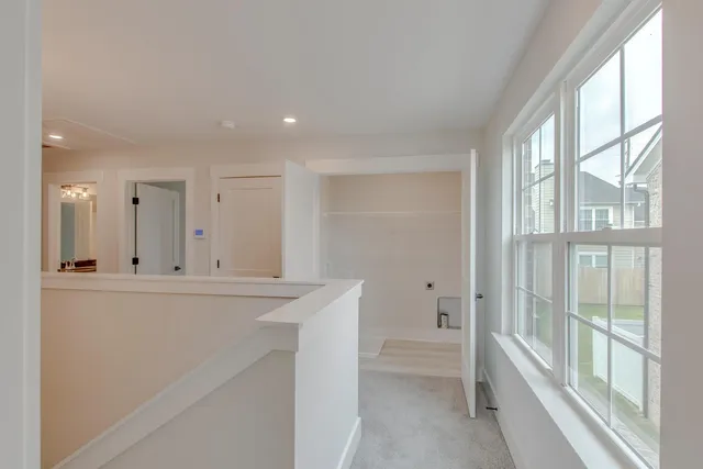a view of open kitchen with granite countertop cabinets