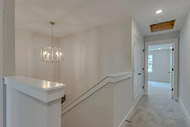 a bathroom with a light fixture and a mirror