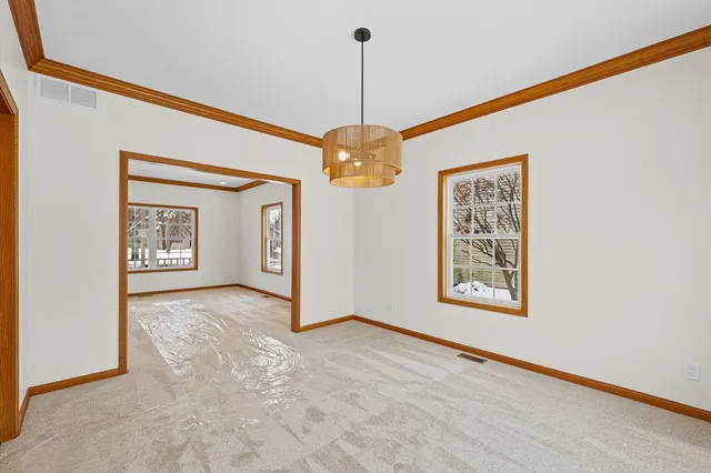 a kitchen with stainless steel appliances granite countertop a sink and a refrigerator