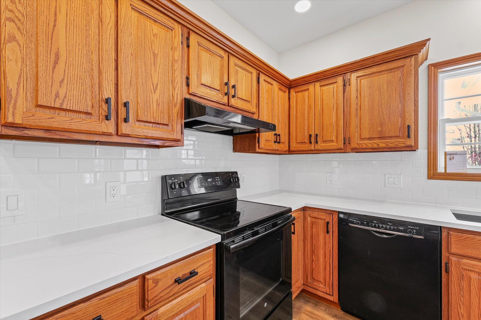 3308 Pebblecreek Place Champaign, IL 61822 - Photo 14 of 57 a kitchen with stainless steel appliances granite countertop a stove a sink and a microwave