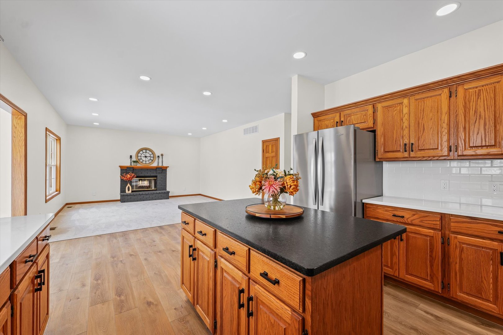 3308 Pebblecreek Place Champaign, IL 61822 - Photo 15 of 57 a kitchen with stainless steel appliances granite countertop a sink and a refrigerator