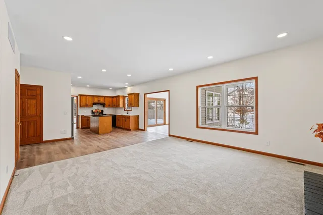a kitchen with a sink cabinets and a window