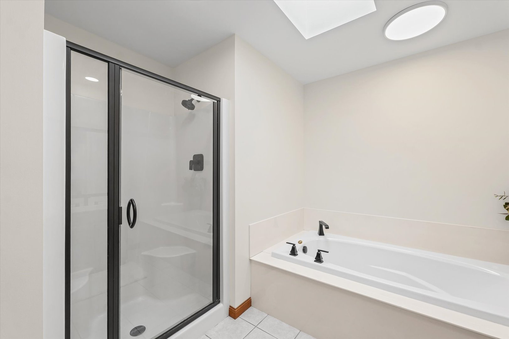 3308 Pebblecreek Place Champaign, IL 61822 - Photo 35 of 57 a bathroom with a tub and a shower