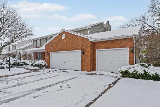 a view of entryway with wooden floor and stairs