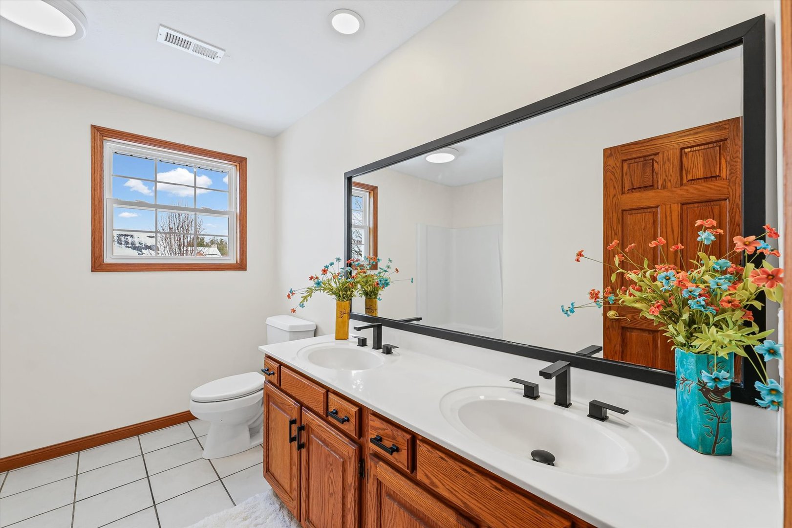 3308 Pebblecreek Place Champaign, IL 61822 - Photo 43 of 57 a bathroom with a sink mirror and vanity