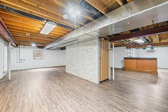 a view of the house with a snow in the yard