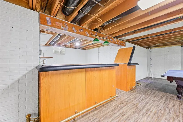 a view of a house with a yard covered in snow