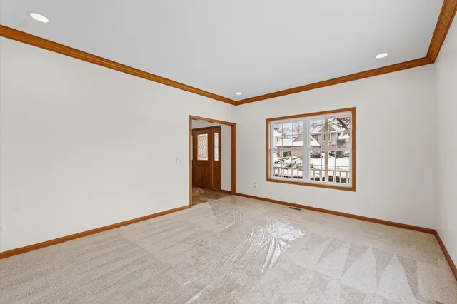 a large kitchen with stainless steel appliances granite countertop a lot of counter space and wooden floor