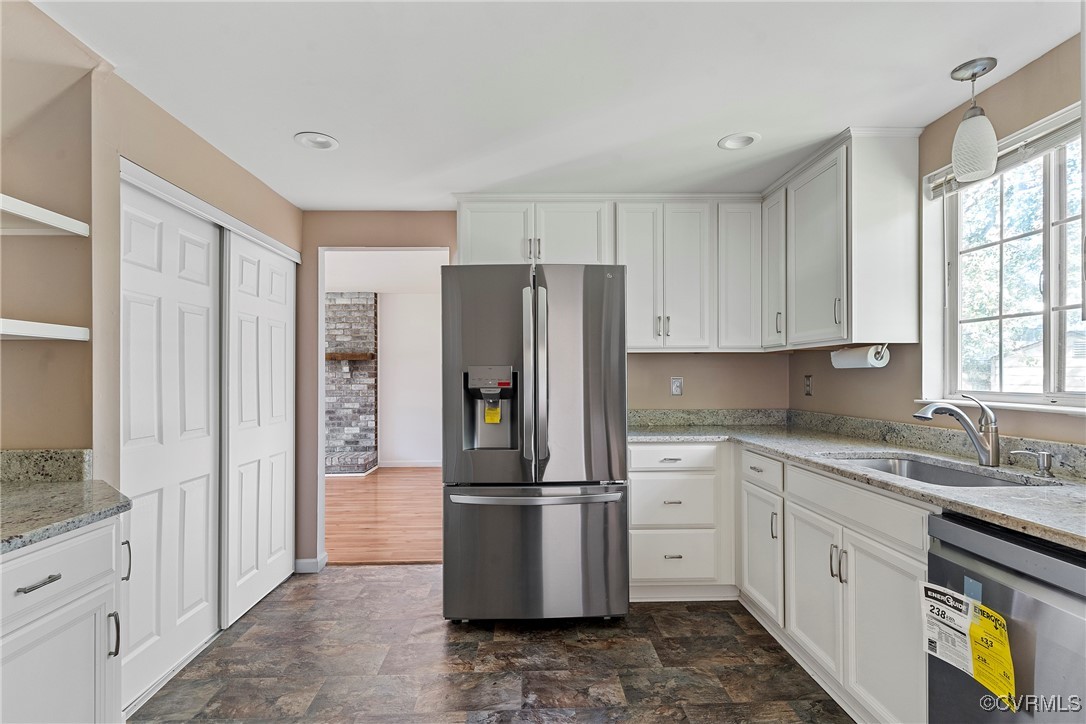 9036 Resaca Road Chesterfield, VA 23236 - Photo 15 of 39 Kitchen featuring stone finish floor, white cabine