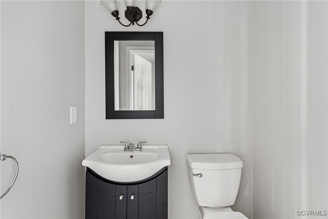 9036 Resaca Road Chesterfield, VA 23236 - Photo 16 of 39 Half bath with vanity and toilet