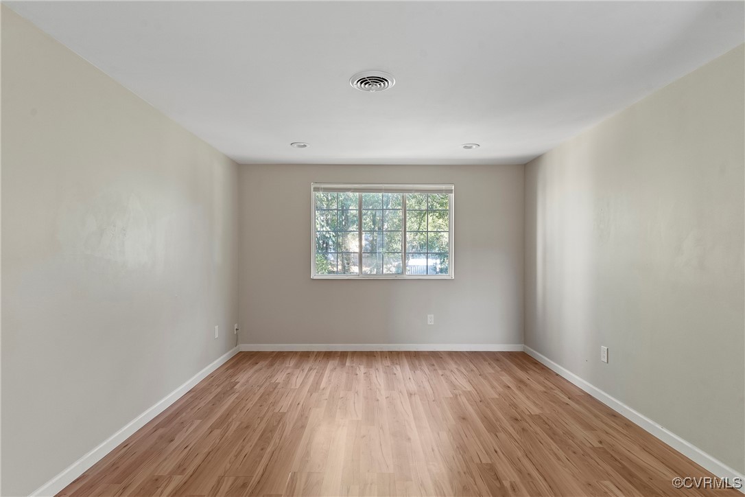 9036 Resaca Road Chesterfield, VA 23236 - Photo 18 of 39 Spare room featuring visible vents, baseboards, an