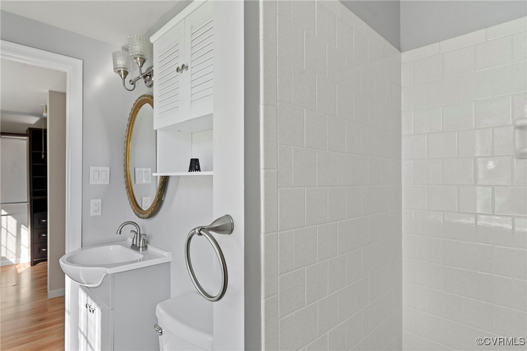 9036 Resaca Road Chesterfield, VA 23236 - Photo 20 of 39 Bathroom featuring toilet, vanity, and wood finish