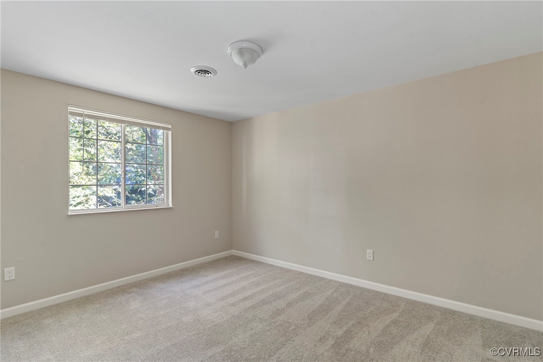 9036 Resaca Road Chesterfield, VA 23236 - Photo 24 of 39 Carpeted spare room with baseboards and visible ve