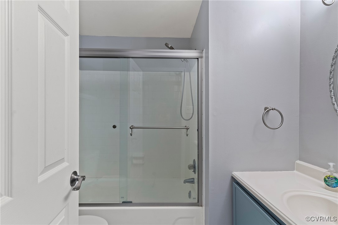 9036 Resaca Road Chesterfield, VA 23236 - Photo 25 of 39 Bathroom with vanity, toilet, and bath / shower co
