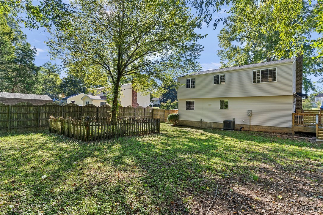 9036 Resaca Road Chesterfield, VA 23236 - Photo 34 of 39 Rear view of property with a yard, cooling unit, a