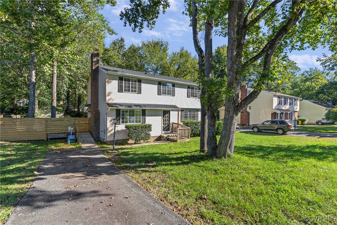 9036 Resaca Road Chesterfield, VA 23236 - Photo 39 of 39 View of front facade with a chimney, a front lawn,