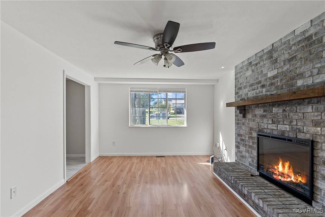 9036 Resaca Road Chesterfield, VA 23236 - Photo 7 of 39 Unfurnished living room featuring ceiling fan, a b