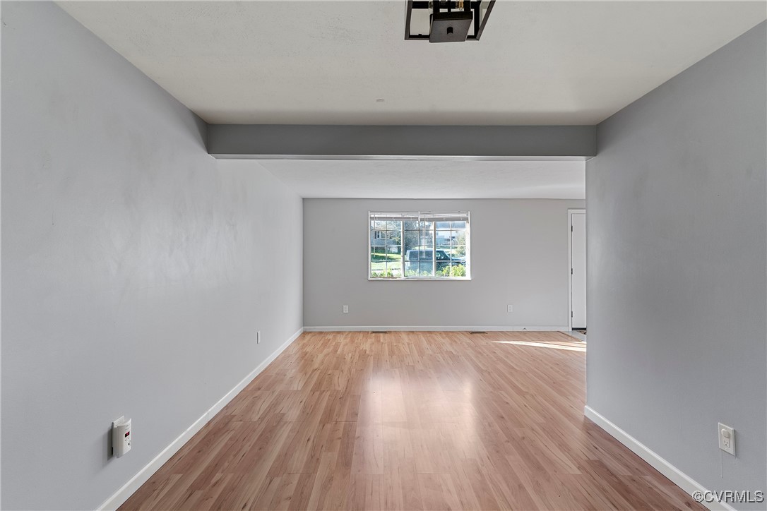 9036 Resaca Road Chesterfield, VA 23236 - Photo 9 of 39 Spare room with baseboards and wood finished floor