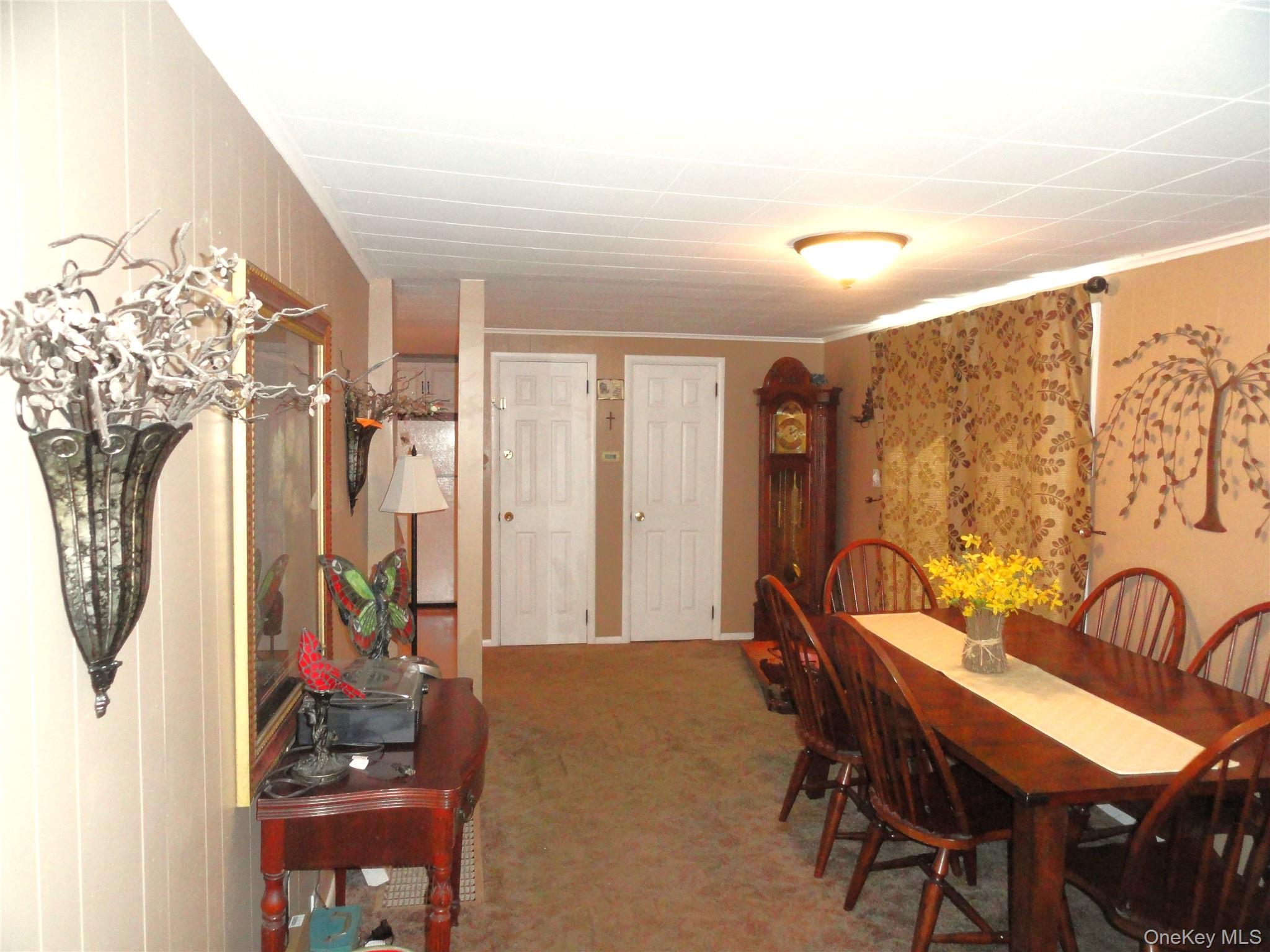 198 Tinkertown Road Salt Point, NY 12578 - Photo 11 of 25 View of carpeted dining space with sliding glass door to outside deck