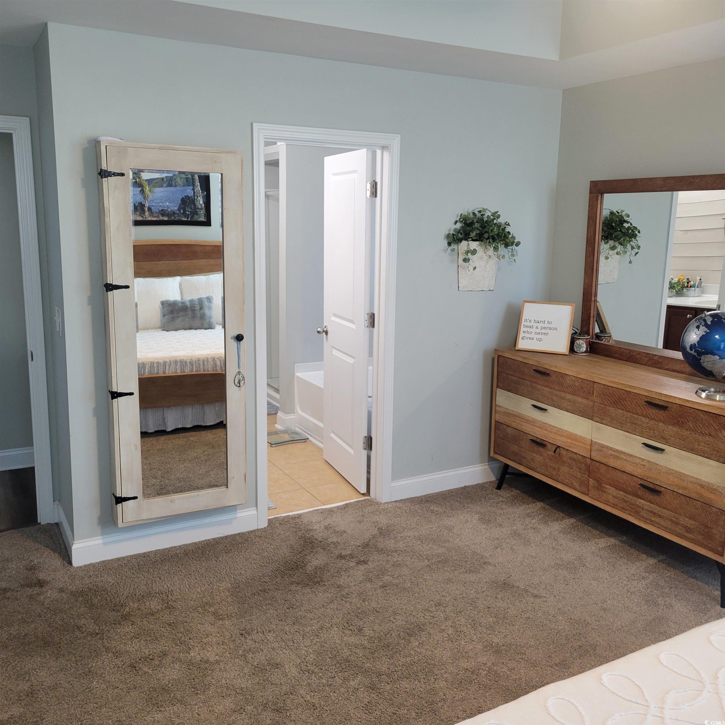 833 Tilly Lake Road Conway, SC 29526 - Photo 12 of 39 Bedroom featuring light colored carpet and connected bathroom