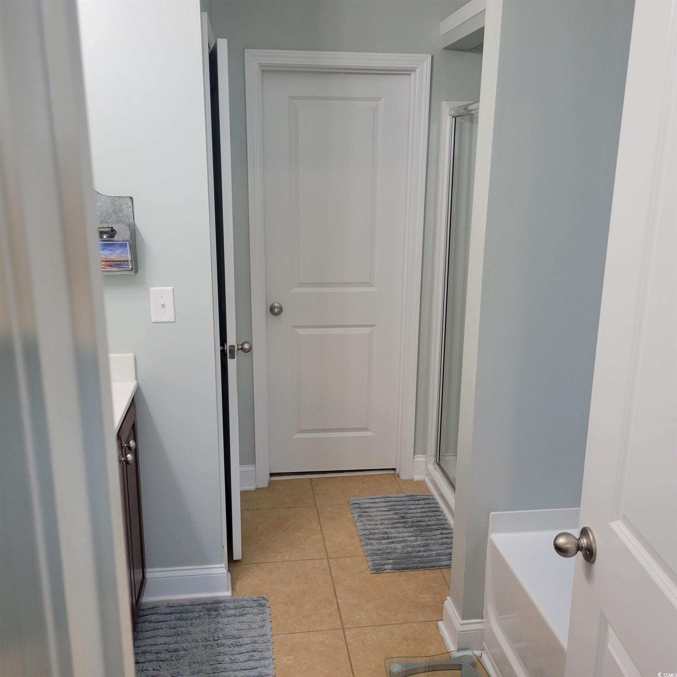 833 Tilly Lake Road Conway, SC 29526 - Photo 13 of 39 Bathroom featuring vanity, light tile patterned floors, a stall shower, and a bath