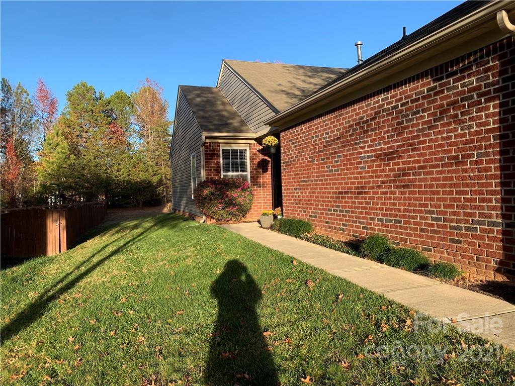 2464 Spring Breeze Way Monroe, NC 28110 - Photo 2 of 5 a backyard of a house with lots of green space
