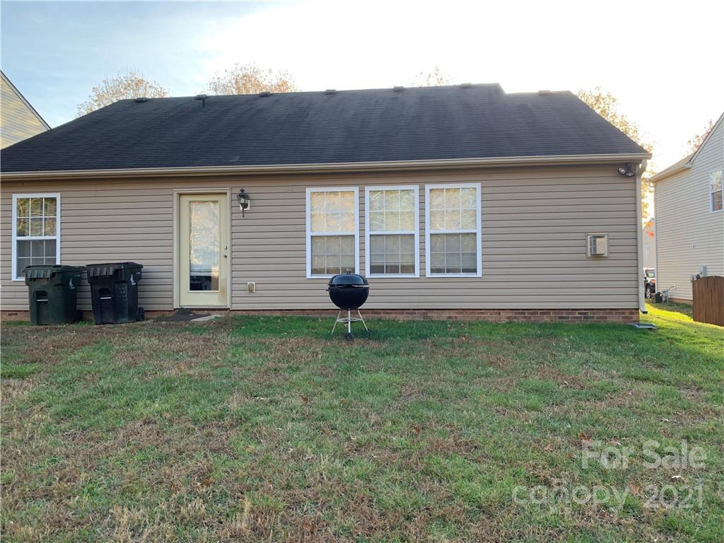 2464 Spring Breeze Way Monroe, NC 28110 - Photo 4 of 5 a front view of a house with a yard