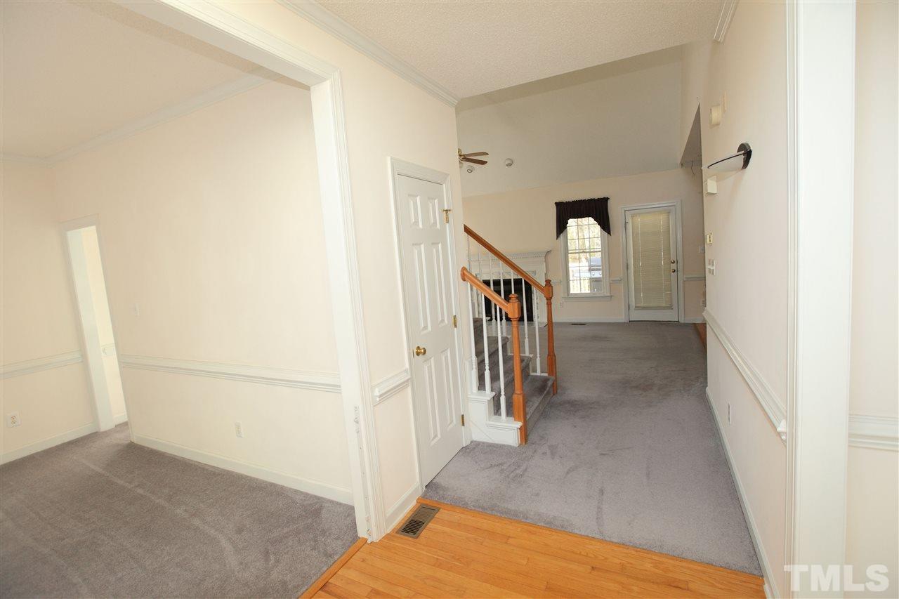 5304 Calverton Drive Raleigh, NC 27613 - Photo 3 of 22 a view of a hallway with a white walls