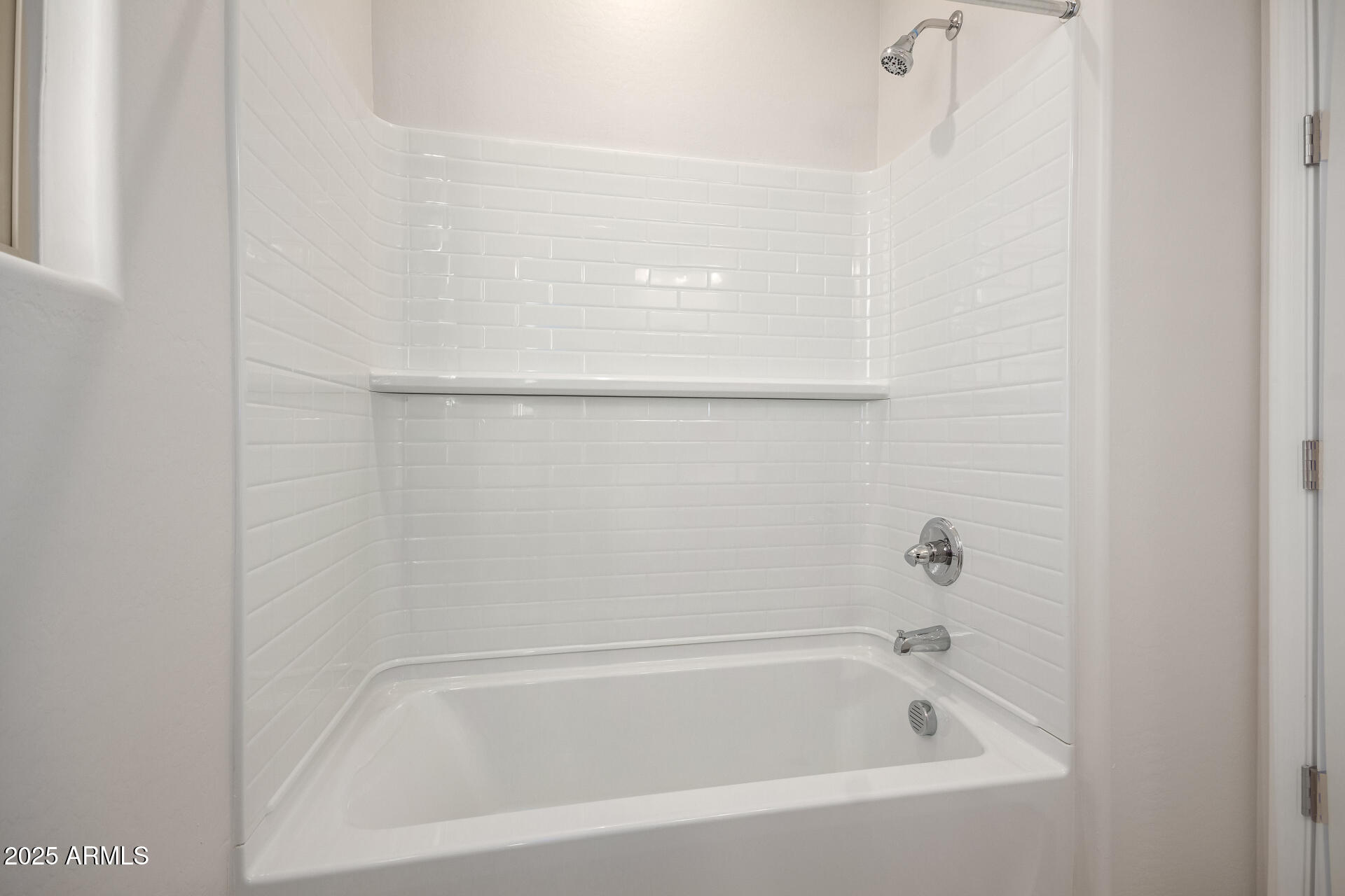 5008 West Roundhouse Road Laveen, AZ 85339 - Photo 22 of 36 a close up of a bathtub in a bathroom